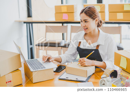 Small business owners online are writing their names and addresses to deliver products and products to their customers. and check the orders that the customers have ordered of online retailers - 110466985