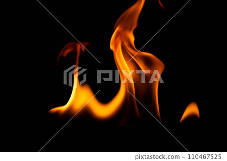 Hot flames on a black background. Beautiful flame of fire in the dark. Abstract of burning flames and smoke. 110467525