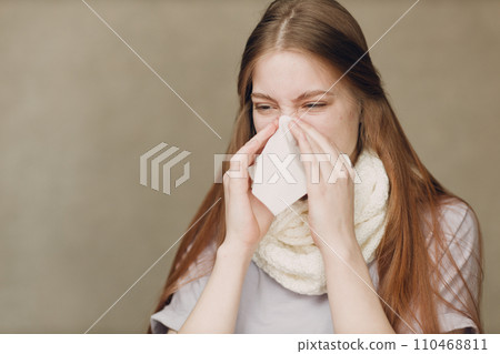 Young woman blowing nose has flu catarrh ill sick disease treatment cold Young woman blowing nose has flu catarrh ill sick disease treatment cold 110468811