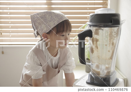 A girl crazy about making cookies in the living room 110469876