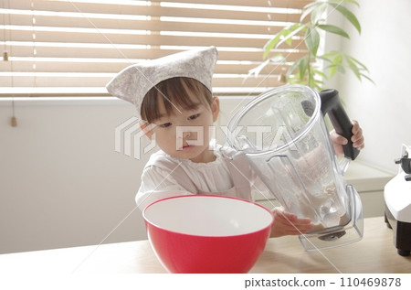 A girl crazy about making cookies in the living room A girl crazy about making cookies in the living room 110469878