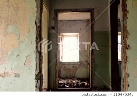 ruins of an old house with window light 110470343