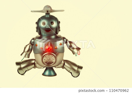 Vintage toy robot on a beige background. Robotics. 110470962