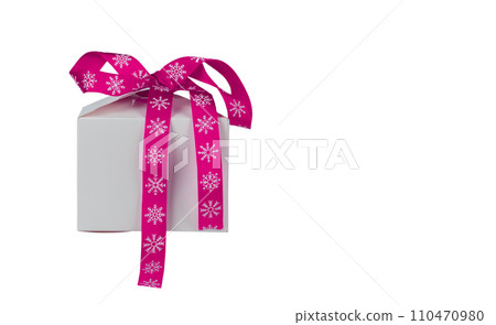 Christmas gift box with pink bow on white background. Christmas gift box with pink bow on white background. 110470980