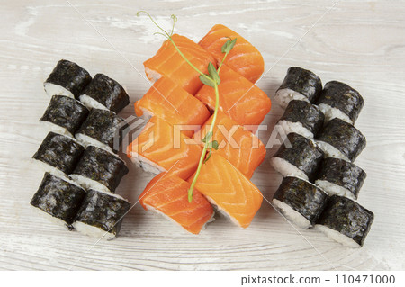 Set of various sushi rolls on a white wooden background close-up. Set of various sushi rolls on a white wooden background close-up. 110471000