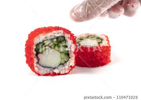 Sushi rolls boned in red artificial caviar on a white background close-up  110471028