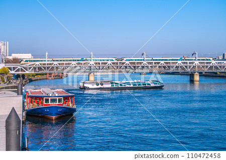 Tokyo cityscape in Japan Ryoma at Asakusa water bus boarding area and Emeraldas departing. Express Liberty in the back = December 29th 110472458