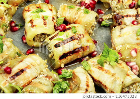 Badrijani, baked eggplant rolls. 110473328