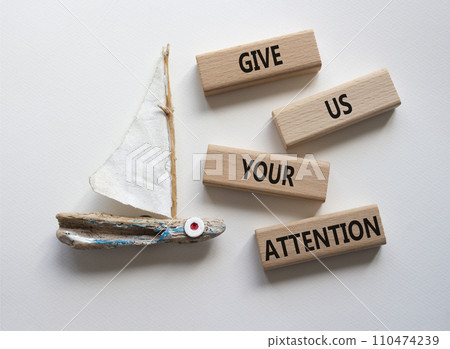Attention symbol. Concept word Give us your attention on wooden blocks. Beautiful white background with boat. Business and Give us your attention concept. Copy space Attention symbol. Concept word Give us your attention on wooden blocks. Beautiful white background with boat. Business and Give us your attention concept. Copy space 110474239
