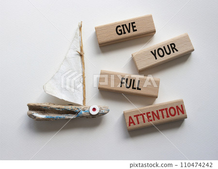 Give your full Attention symbol. Concept word Give your full Attention on wooden blocks. Beautiful white background with boat. Business and Give your full Attention concept. Copy space Give your full Attention symbol. Concept word Give your full Attention on wooden blocks. Beautiful white background with boat. Business and Give your full Attention concept. Copy space 110474242