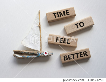 Time to feel better symbol. Wooden blocks with words Time to feel better. Beautiful white background with boat. Medicine and Time to feel better concept. Copy space. 110474250