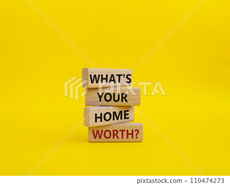 What is your home worth symbol. Wooden blocks with words What is your home worth. Beautiful yellow background. Business and What is your home worth concept. Copy space. 110474273