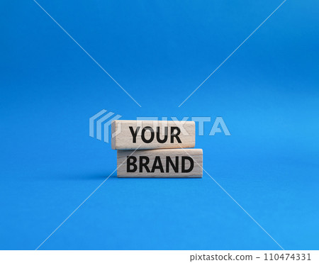 Your Brand symbol. Concept word Your Brand on wooden blocks. Beautiful blue background. Business and Your Brand concept. Copy space 110474331