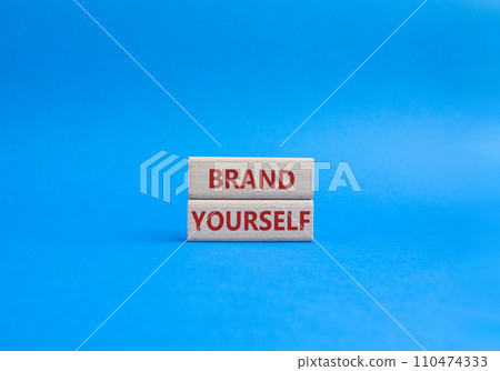 Brand yourself symbol. Concept word Brand yourself on wooden blocks. Beautiful blue background. Business and Brand yourself concept. Copy space 110474333