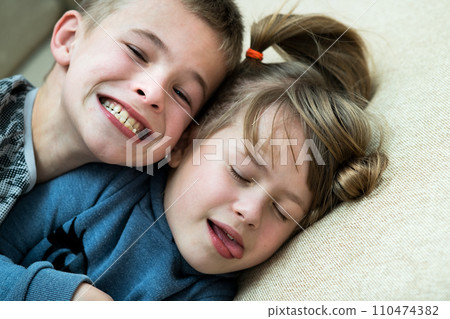 Two children boy and girl fooling around having fun together. Happy childhood concept. 110474382