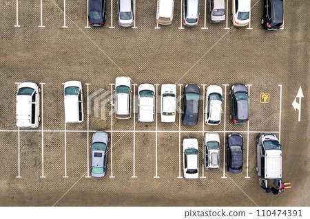 Top down aerial view of many cars on a parking lot of supermarket or on sale car dealer market. 110474391