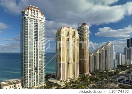 Expensive highrise hotels and condos on Atlantic ocean shore in Sunny Isles Beach city. American tourism infrastructure in southern Florida 110474802