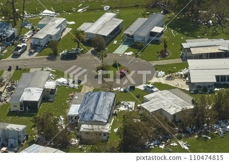 Destroyed by hurricane Ian suburban houses in Florida mobile home residential area. Consequences of natural disaster 110474815
