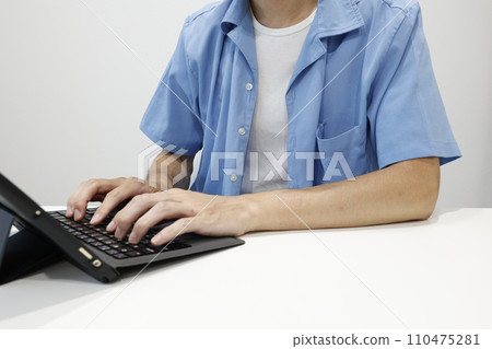 person working on a tablet computer person working on a tablet computer 110475281