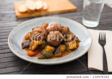 Cooked meatballs with stewed eggplant with haze in bowl Cooked meatballs with stewed eggplant with haze in bowl 110476162