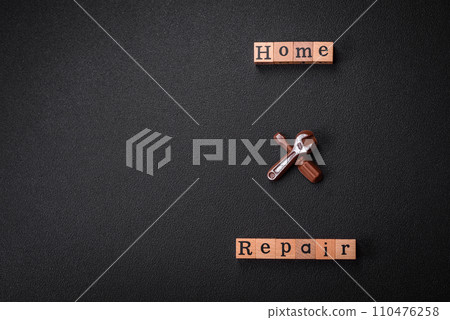 Tools and inscriptions symbolizing repairs or a garage and its attributes on a plain background Tools and inscriptions symbolizing repairs or a garage and its attributes on a plain background 110476258
