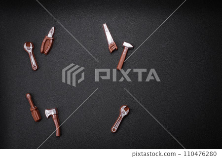Tools and inscriptions symbolizing repairs or a garage and its attributes on a plain background 110476280