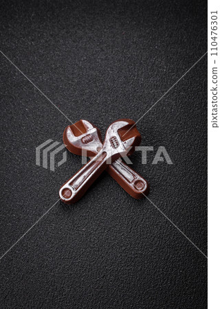 Tools and inscriptions symbolizing repairs or a garage and its attributes on a plain background 110476301