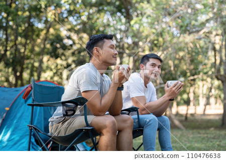 Happy Asian male gay couple on camping together in a forest. romantic vocation trip. lgbt concept 110476638