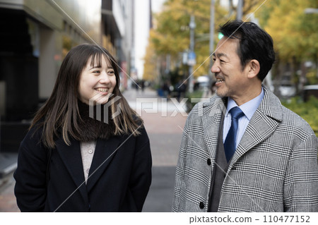 Smiling father and daughter Smiling father and daughter 110477152