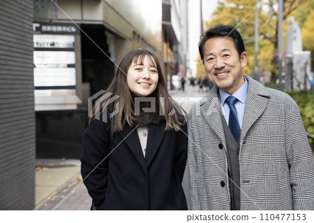 father and daughter looking at camera father and daughter looking at camera 110477153