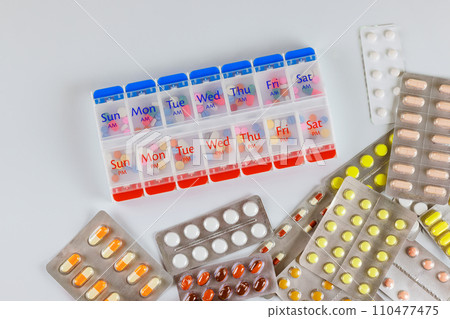 Drugs used for treatment are weekly organizer dispensers for tablets, capsules, blister packs of medicines 110477475