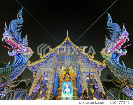 Viharn and dragons at Wat Rong Suea Ten Blue temple, Chiang Rai, Thailand 110477941
