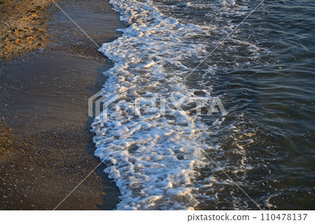Waves on the beach at sunset Waves on the beach at sunset 110478137