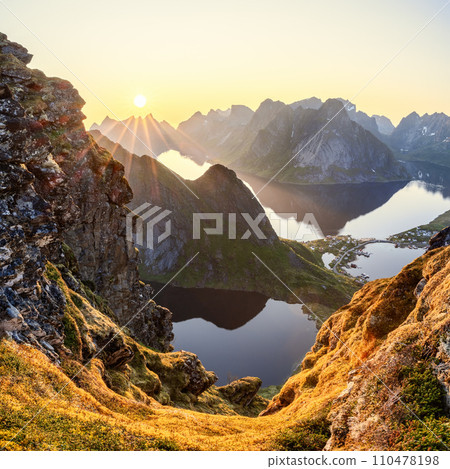 Ethereal light from the midnight sun bathes Reinebringen in a serene glow 110478198