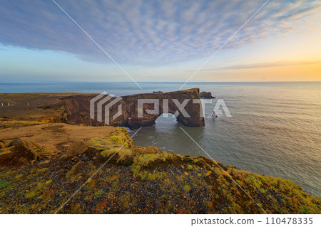 Dyrholaey in iceland with sea beach. Tourist attraction. Dyrholaey in iceland with sea beach. Tourist attraction. 110478335