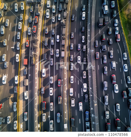 Busy traffic on a large highway, view from above. A lot of cars on the highway, traffic jam Busy traffic on a large highway, view from above. A lot of cars on the highway, traffic jam 110478566