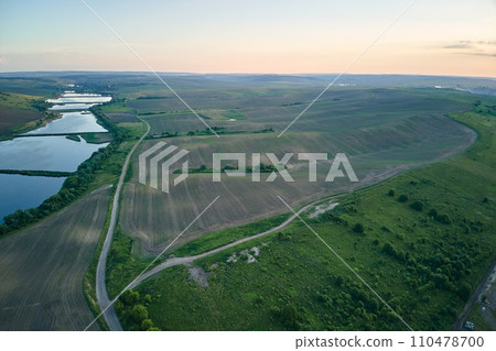Aerial view of fish hetching pond with blue water in aquacultural area Aerial view of fish hetching pond with blue water in aquacultural area 110478700