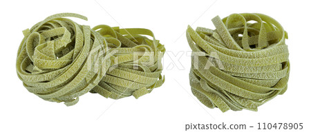 Raw tagliatelle green pasta with spinach isolated on white background 110478905
