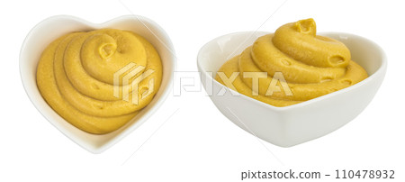 Mustard sauce in ceramic bowl with seed isolated on white background. Top view. Flat lay Mustard sauce in ceramic bowl with seed isolated on white background. Top view. Flat lay 110478932