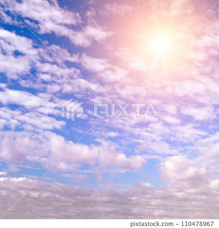 Cumulus clouds and bright sun in the sky. Cumulus clouds and bright sun in the sky. 110478967