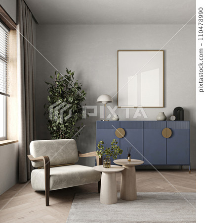 Modern living room with plush armchair, stylish blue sideboard, and tasteful home accents creating a chic space 110478990