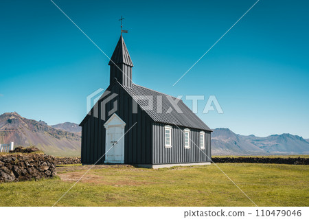 Budakirkja is the famous black church in summer at Iceland Budakirkja is the famous black church in summer at Iceland 110479046