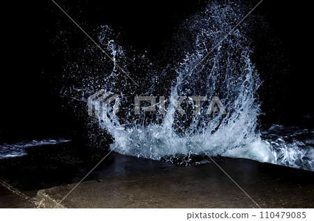 Splashing wave on the Black sea in the night. 110479085