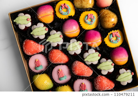 Marzipan sweets as fruits 110479211