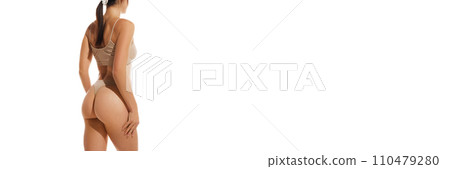 Cropped image of slim. fit female body, buttocks in underwear against white studio background. Anti-cellulite massage, care Cropped image of slim. fit female body, buttocks in underwear against white studio background. Anti-cellulite massage, care 110479280