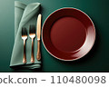 Empty table plate setting on green background. 110480098