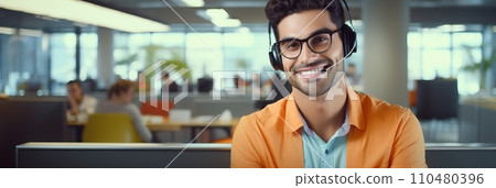 Smiling Latina man with headphones and microphone in a call center, banner Smiling Latina man with headphones and microphone in a call center, banner 110480396
