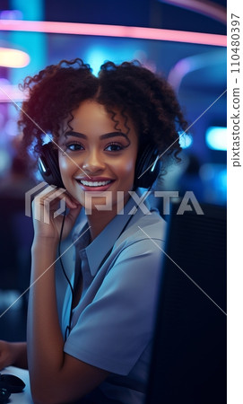 A smiling African-American woman with headphones and a microphone in a call center A smiling African-American woman with headphones and a microphone in a call center 110480397