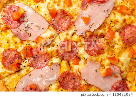 Background with delicious classic italian Pizza Pepperoni with sausages and cheese mozzarella. Background with delicious classic italian Pizza Pepperoni with sausages and cheese mozzarella. 110481084