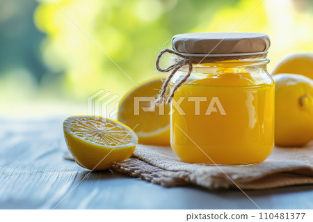 AI-generated content. Lemon curd in clear jar surrounded by fresh lemons, close up 110481377